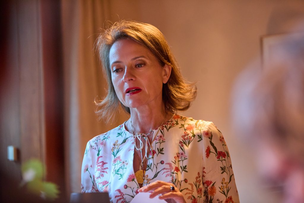 Dr. Zrinka speaking during a live reading and strategic leadership conversation event in Frankfurt